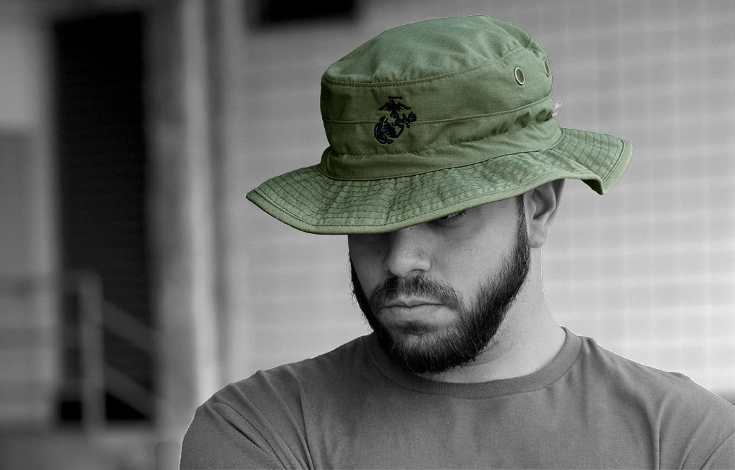Model wearing OD Green boonie hate with embroidered EGA logo